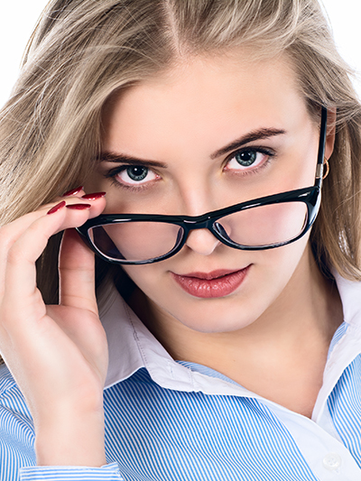 blond woman in a blue sweater wearing eyeglasses